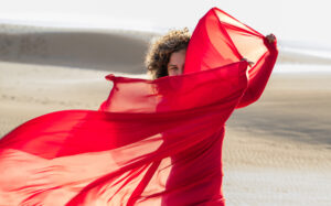 woman with red scarf at the Dunes of Pyla